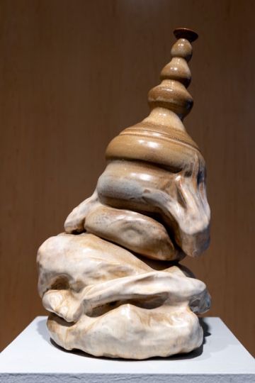 Ceramic vase with folds that look like flesh