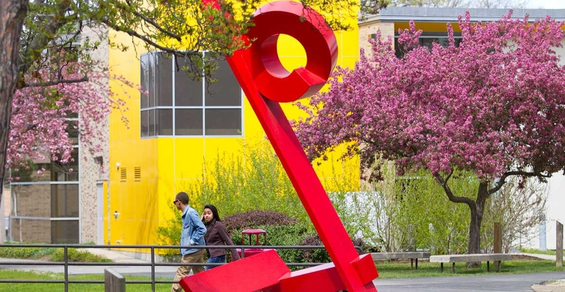 Campus art sculpture in front of Alger Hall