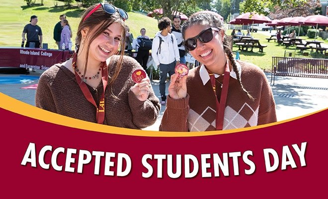 Smiling students holding "I love RIC" buttons