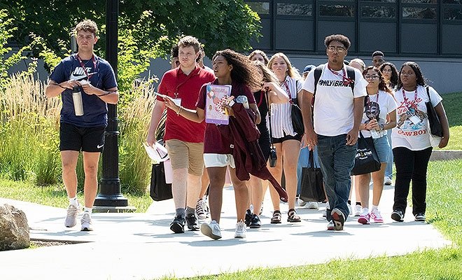 Students on campus tour during the summer, led by student ambassador