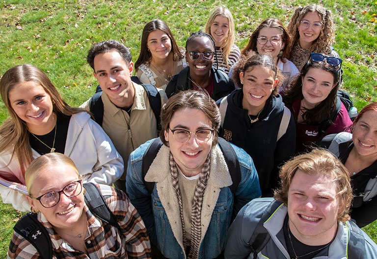 Smiling students looking up at camera