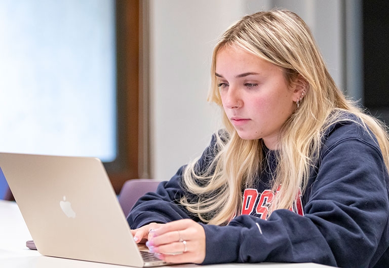 Student working at laptop