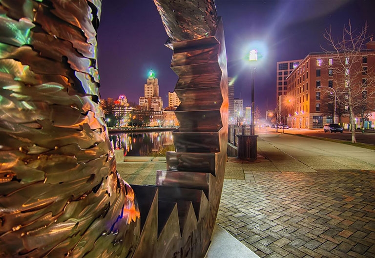 Providence, Rhode Island skyline, looking through a sculpture at night