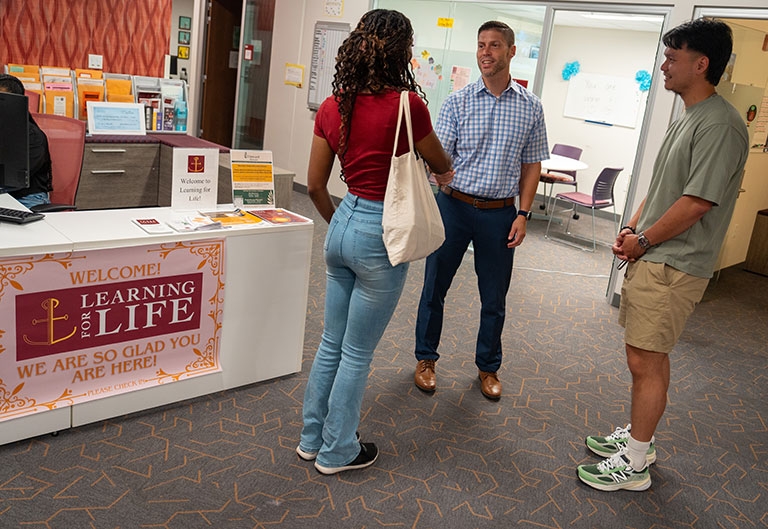 Students being greeted in Learning for Life office