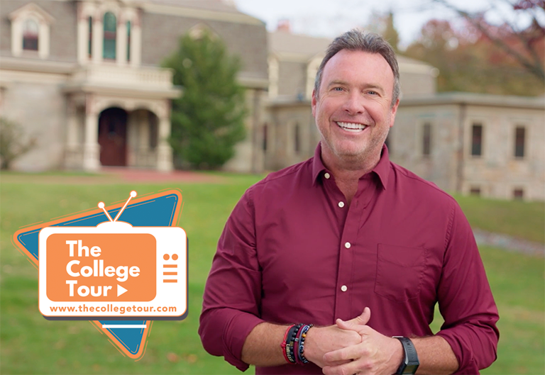 The College Tour host, Alex Boylan, in front of Forman Admissions building 