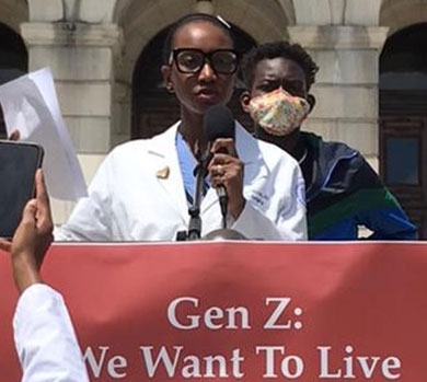 Dr. Moreira speaks at the Code Black: Health Equities for Black Lives march at the Rhode Island State House on June 14, 2020.