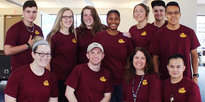 Front, from left to right: Vanessa Ruggieri, Keighan Roy, RIC Assistant Professor of Management Leslie DiManna and Auder Aldana. Back, from​ left to right: Lucas DiManna, Stephanie Brodeur, Casey Ganshirt, Nelida Silva, Kelly Smith, Gian DiManna and Edwin Jorge​