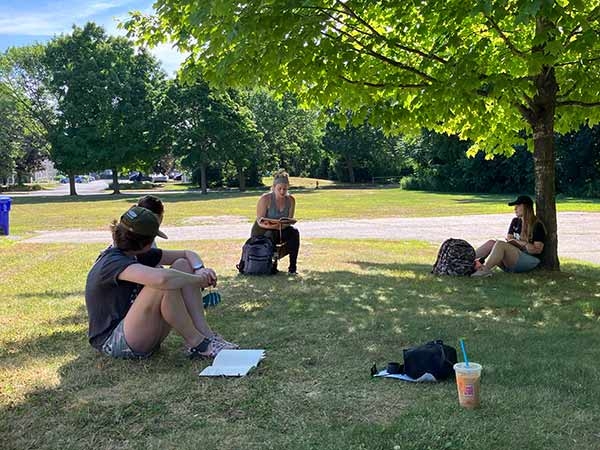 writers outside in the shade