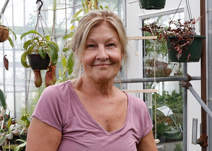 Pam Hill in greenhouse