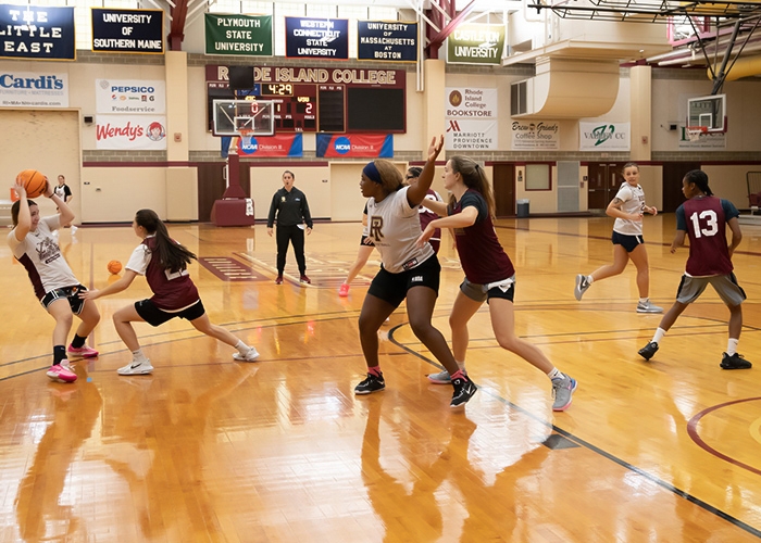 Women's basketball team in practice on the court