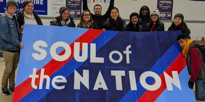students holding soul of the nation sign