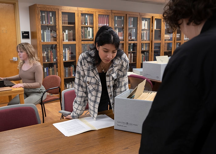Students conduct their research in Special Collections at Adams Library