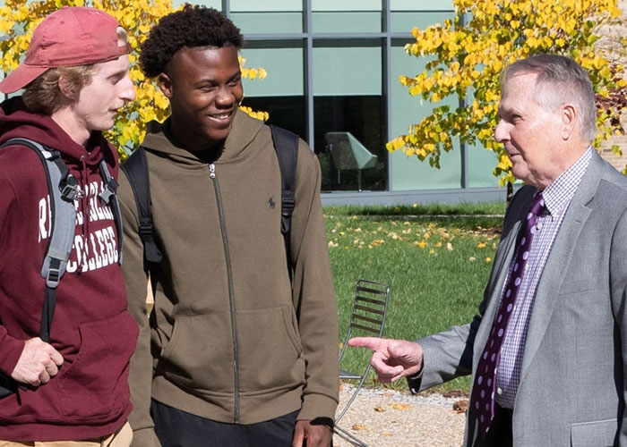 RIC President Jack Warner talks to students