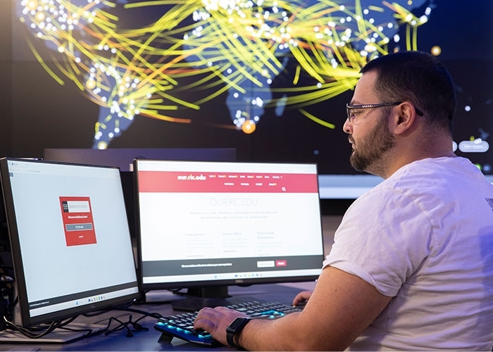 Miled Kalbourji sitting at cyber range workstation