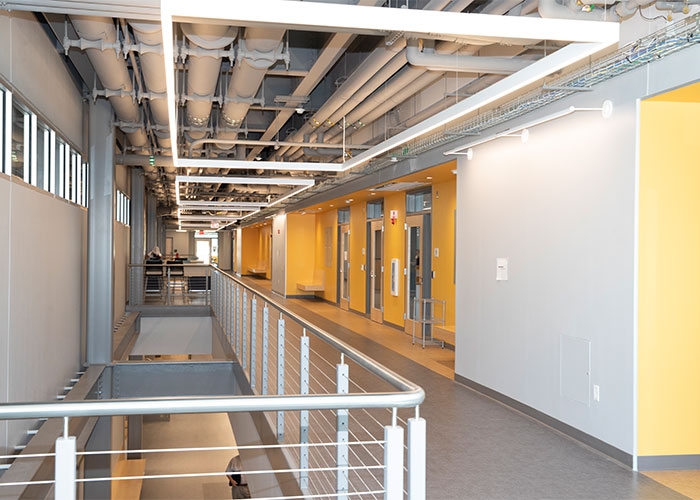 Second-floor ceiling has the raw look of the hull of a spacecraft in a sci-fi film.