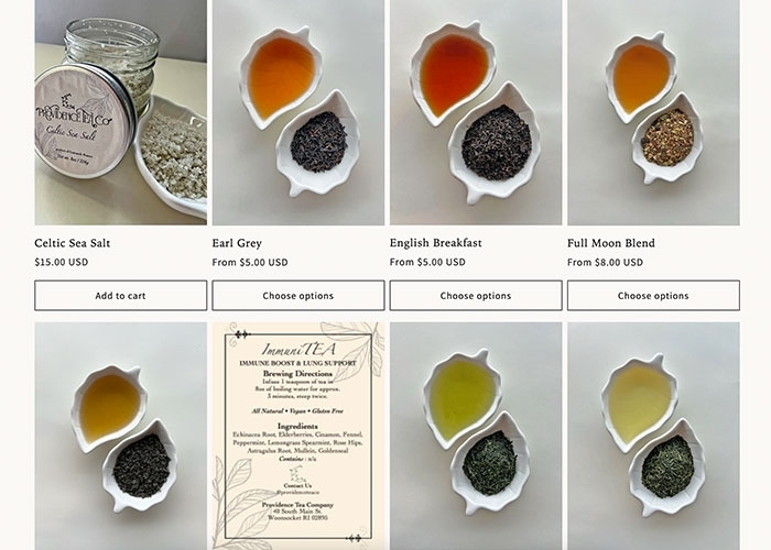 Display of small dishes of tea and tea leaves