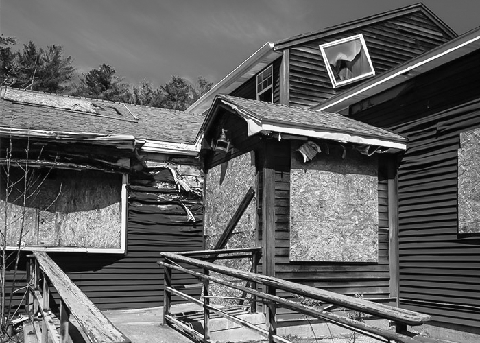 Black and white photograph by Simone Emerich of a dilapidated building