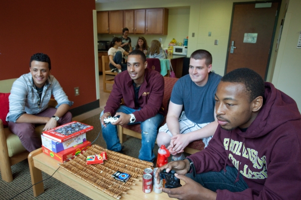 Students playing video games in residence hall