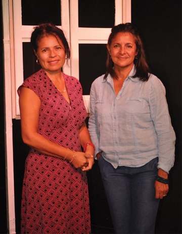 RIC alumna Anna Cano-Morales (left) stands next to ECAS Theatre co-founder Francis Parra (right)