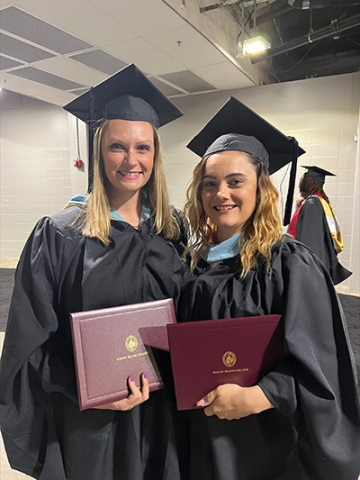 Two MEd Health Education graduate students at Commencement