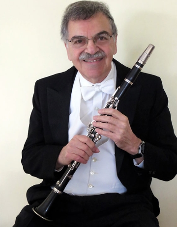 The late musician and philanthropist Edward Avedisian poses with his clarinet