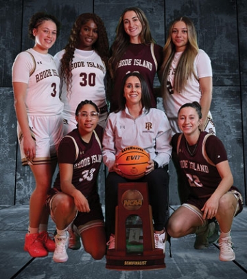 Women's basketball team members with coach Jenna Cosgrove and trophy
