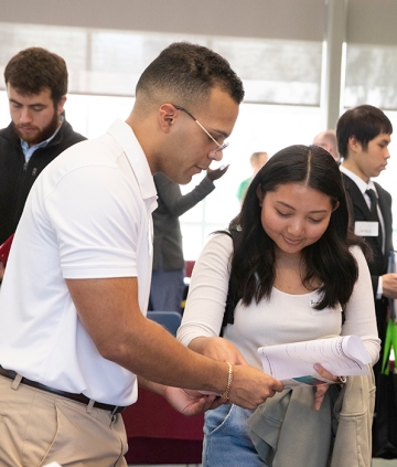 Accounting employer with student at job fair