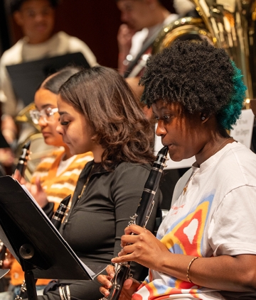 Music academy class students playing clarinets