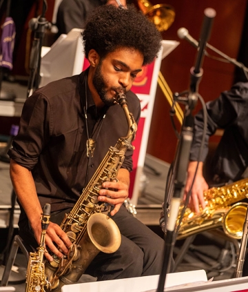 Music student playing saxophone in RIC Jazz Band