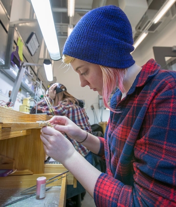 Art metal smithing student at work