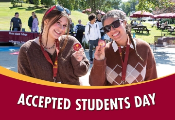 Smiling students holding "I love RIC" buttons for Accepted Students Day