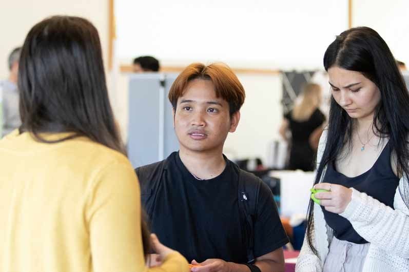 two students seeking advice at job fair