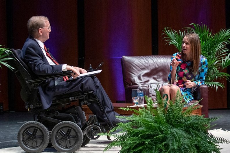 U.S. Representative Jim Langevin and Director of the Cybersecurity and Infrastructure Security Agency (CISA) Jen Easterly sit on stage for fireside chat during the launch of the Institute for Cybersecurity & Emerging Technologies 