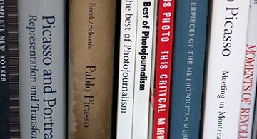 Art history books on a shelf