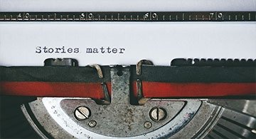 Typewriter writes "stories matter"
