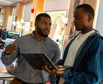 Student working with Antonio Rocha in the Center for Scholar Development