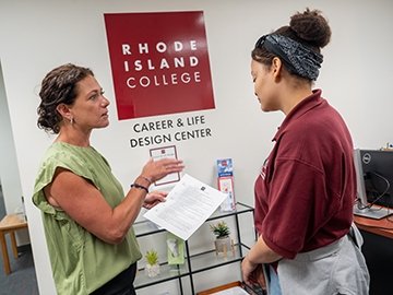 Thea Cerio working with a student in the Career & Life Design Center