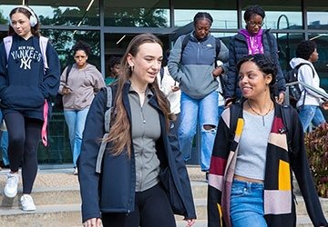 Diverse group of students walking out of Gaige Hall