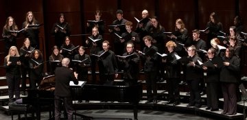 RIC chorus during performance, with director conducting
