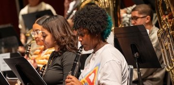 Young musicians playing orchestral instruments