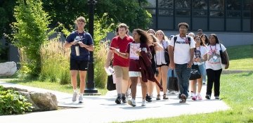 Students on campus tour during the summer, led by student ambassador