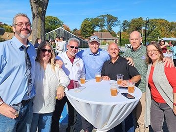 Alumni around an outdoor table