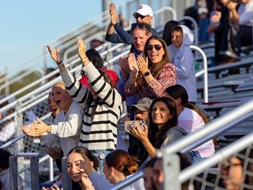 Crowd cheering in bleachers