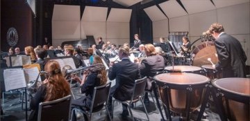 View of RIC Wind Ensemble featuring kettle drum and woodwind instruments