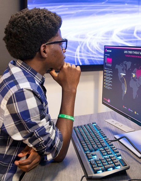 Student sitting at computer in cyber range