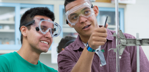 Two male students in a laboratory doing an experiment 