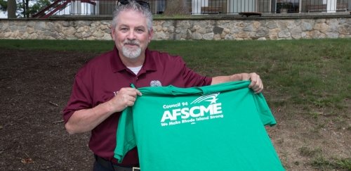 RIC staff displaying AFSCME Council 94 shirt
