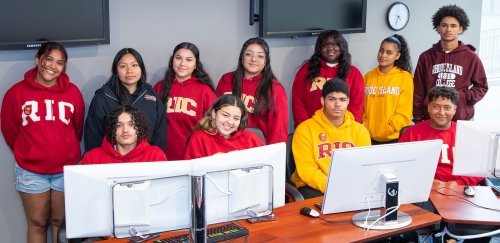 Eleven high school business interns wearing RIC t-shirts