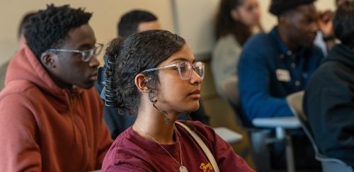 Diverse students sitting at desks during Center for Scholar Development celebration