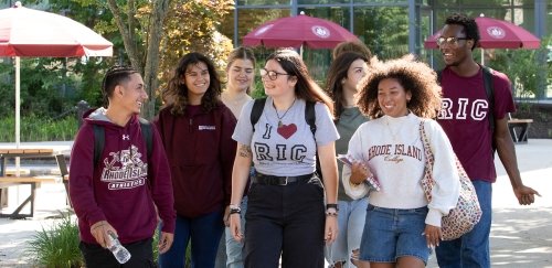 Students in RIC gear walking together on campus